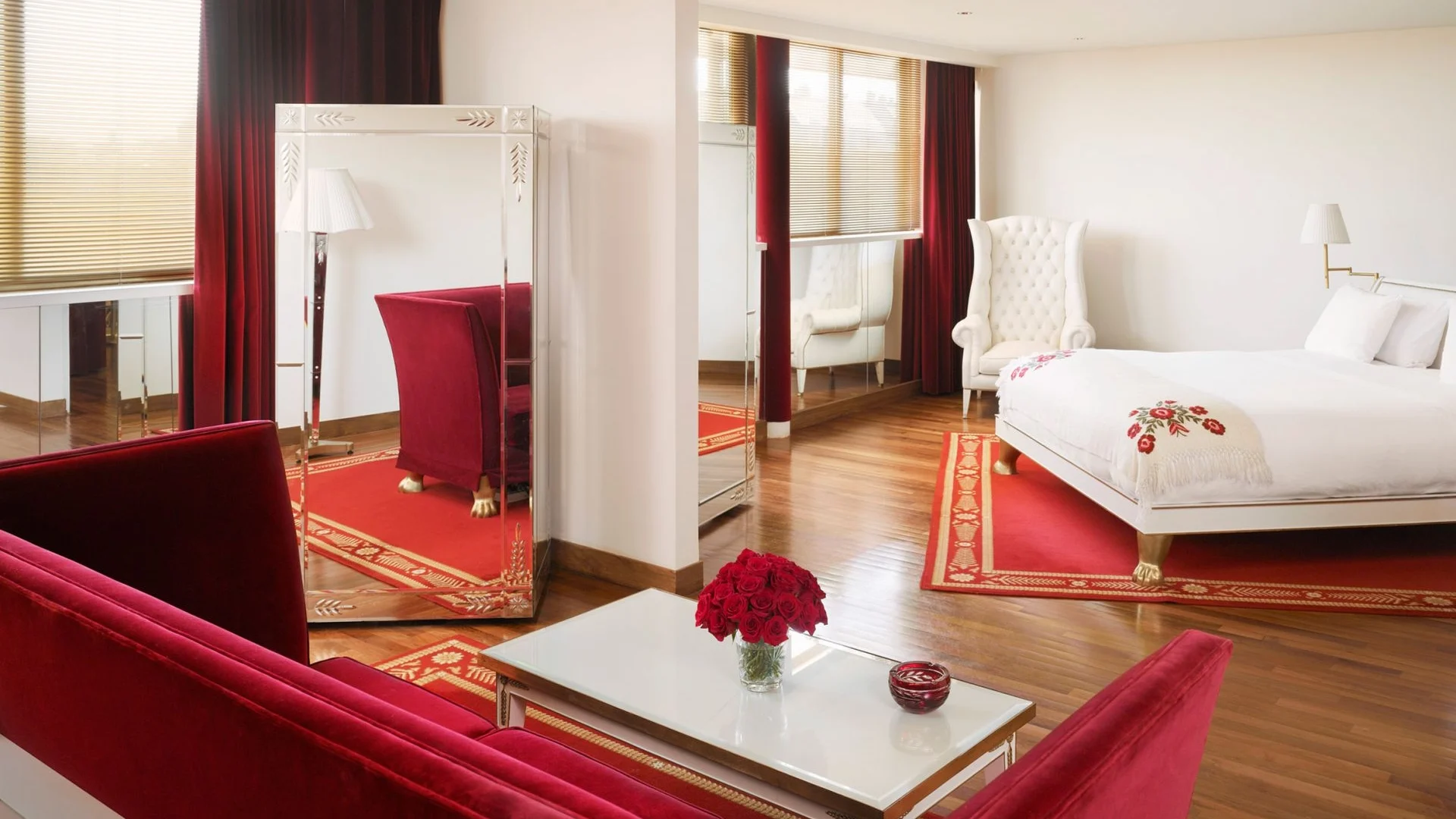 hotel suite with bed and seating area